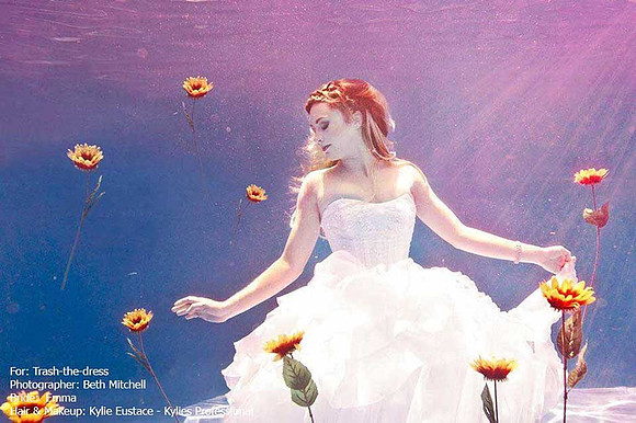 Underwater bride Emma, trashes the dress in style